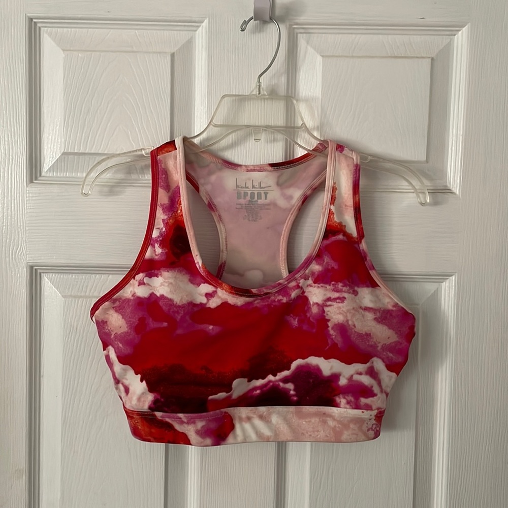 I am selling a pink multi color sports bra in a size large